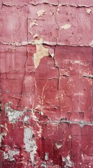 Vertical view of a burgundy wall with peeling and flaking paint, showcasing a rich palette of distressed textures.