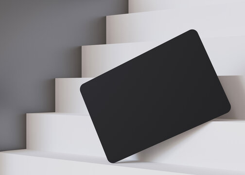 Stylish black business card mockup on a cascading white staircase, perfect for a bold and modern branding presentation. European size, 3,25 x 2,17 inch. Visiting, name card. Rounded corners. 3D.