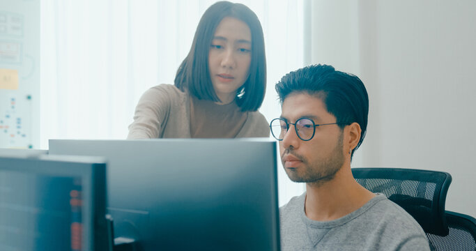 Group Adult Asia male, female freelance meeting write prompt AI bot IT app smart program nomad, video game, talk strategy, discuss plan, user interface, designer, big data center on desktop computer.