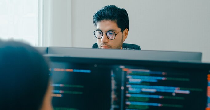 Group Adult Asia male, female freelance typing write prompt AI bot IT app smart program nomad, video game, terminal with coding language, user interface, designer, big data center on desktop computer.