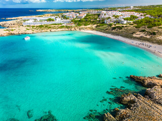 Fototapeta na wymiar Areal drone view of Arenal de Son Saura beach at Menorca island, Spain