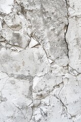 A white wall with visible cracks and damage. Suitable for renovation or construction concepts
