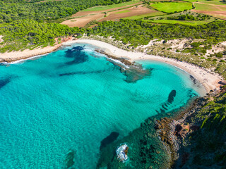 Aerial drone view of Menorca beach at cala de Algariens, Spain