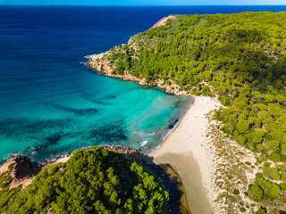 Aerial drone view of Menorca beach at cala de Algariens, Spain