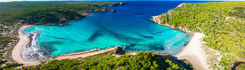 Aerial drone view of Menorca beach at cala de Algariens, Spain - obrazy, fototapety, plakaty