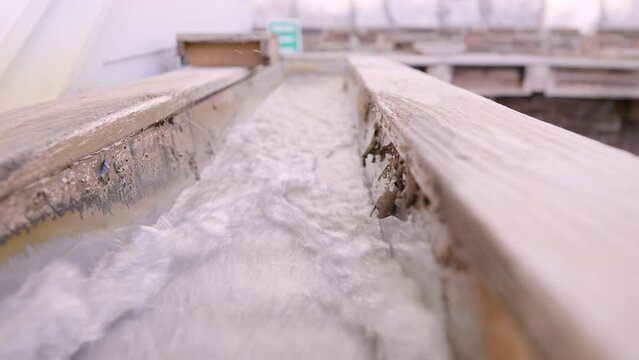 Water running through sluice box mining attraction.  Visitors can search for rare gemstones and minerals.