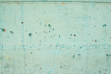 Imagen horizontal de una pared de hormigón color azul con desgaste y textura vieja 