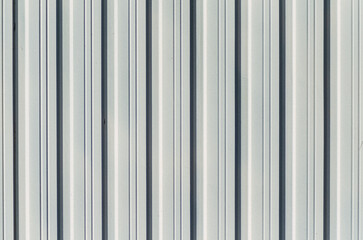 texture background of a metallic colored corrugated metal door