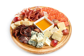 Antipasto plate with cheese, prosciutto, salami and honey
