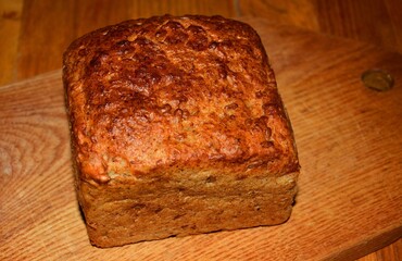 Very delicious wheat-rye bread with sunflower seeds on the board