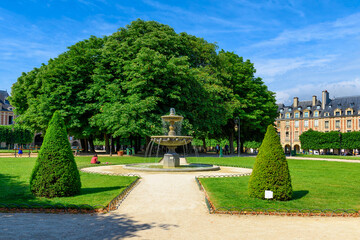 Place des Vosges (Place Royale) is the oldest planned square in Paris and one of the finest in the city. It is located in the Marais district in Paris, France - 772528089