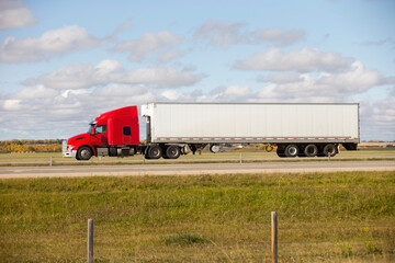 Heavy Cargo on the Road. A truck hauling freight along a highway. Taken in Alberta, Canada