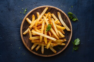 Crunchy gourmet french fries, a delectable and indulgent snack - obrazy, fototapety, plakaty