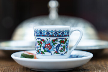 Turkish Coffee Cup and Turkish Delight on the Background of Ottoman Tile Motifs, Colorful Candy and...