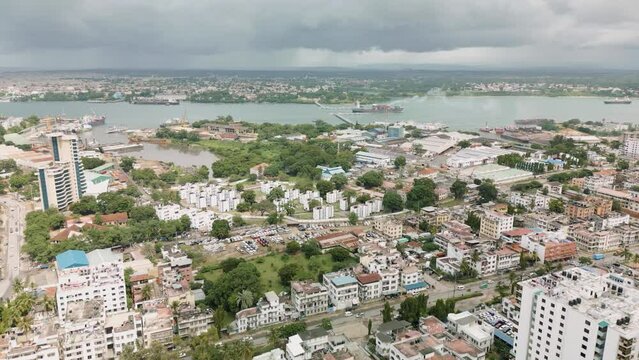 Areal Tracking shot of African coastal industrial port City town Cloudy day Mombasa County, Kenya
