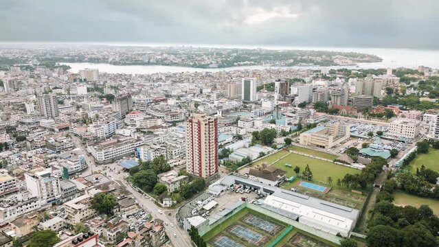 Aerial footage of cityscape of African coastal port City town Cloudy day Mombasa County, Kenya