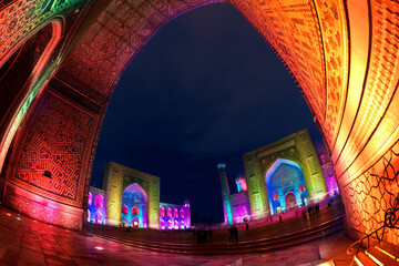 Night view of the highlighted Registan square during the light show. Samarkand, Uzbekistan
