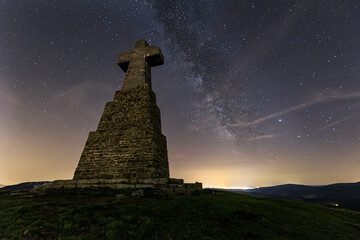 night view on a summer night with the starry sky and the milky way over the cross of Mount...