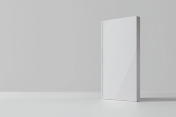 A solitary white box sits atop a table against a light gray background, creating a simple yet striking composition