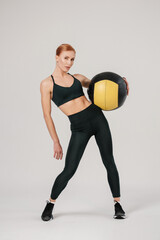 athletic woman training with fit ball