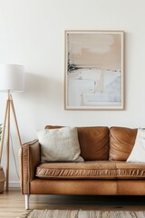 Elegant minimalist living room interior with stylish leather sofa and modern art