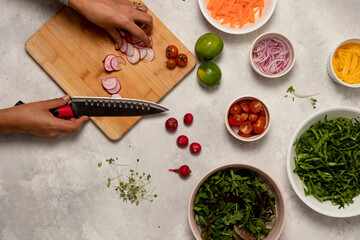 Farm-to-Table Cooking: Woman Slicing Fresh Radish for Salad