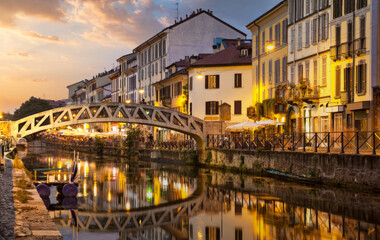 Peaceful Evening at Milan's Navigli Canal, Featuring the Arched Bridge