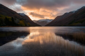 Scotlands Loch Dunvegan bathed in golden sunrise glow