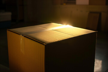A Neglected Cardboard Box Bathing in Sunshine in a Warehouse