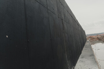 Prime Adhesive Basement Wall In Black, Cement Texture At Construction Site