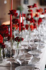 Beautifully organized event - round served table banquet ready for guests, round decorated table with empty plate, glasses, forks, napkin. Elegant dinner table 
