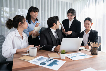 Diverse group of business analyst team analyzing financial data report paper on office table. Chart...