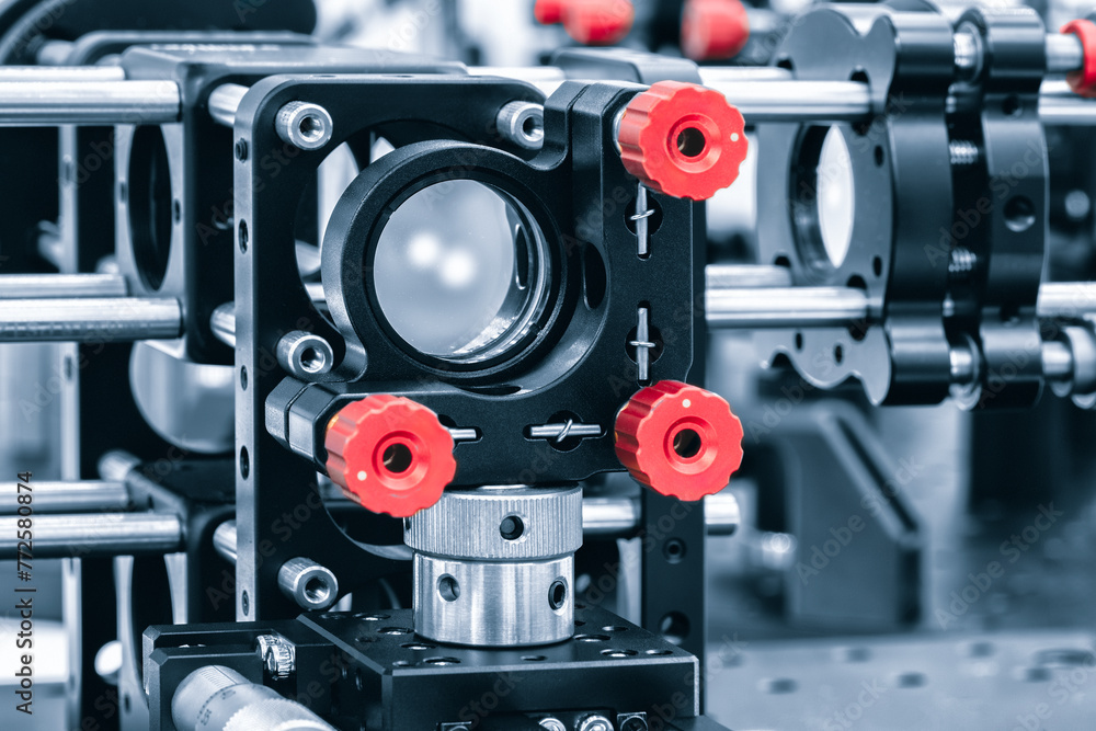 Poster Experiment with laser device in optical laboratory. Experiment in optic lab with laser device.