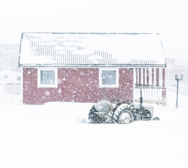 Batsfjord, Norway: old farm house during heavy snow - 772581014