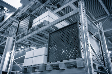 modern distribution warehouse with boxes on racks