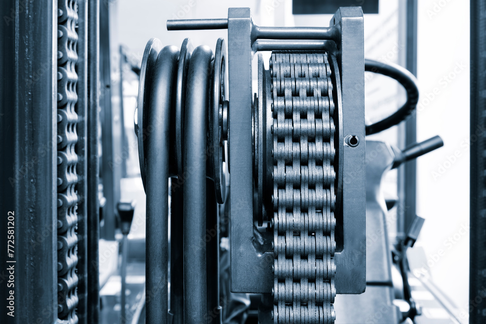 Poster a chain is shown in a black and silver color of warehouse forklift. the chain is made of metal and h