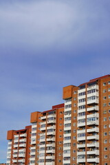 Looking up to red (orange) brick with many windows, Lasnamae, Tallinn, Estonia, Europe. 2024