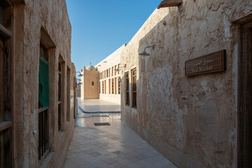 Fototapeta na wymiar Wakra, Qatar - March 28, 2024: Old buildings architecture in the Wakrah souq (Traditional Market).