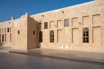 Fototapeta premium Wakra, Qatar - March 28, 2024: Old buildings architecture in the Wakrah souq (Traditional Market).