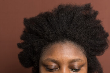 A woman with afro curly hair with shrinkage, woman with type 4c hair