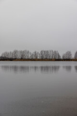 frozen lake in winter in cloudy weather, ice on the lake ts