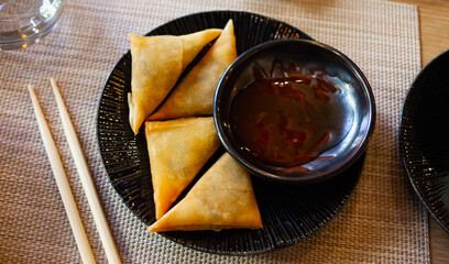 Traditional Portuguese dish with Asian twist - samosas or chamucas filled with spicy curry leaves...
