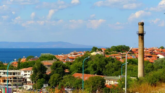 Sozopol, Bulgaria. Visited the city. Red tiled roofs. Sea. Blue sky with clouds. Pipe boiler room.