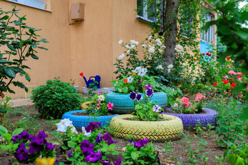 A colorful garden with a variety of flowers and plants