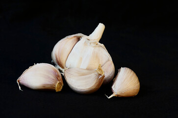 isolated garlic on black background HD closeup photo