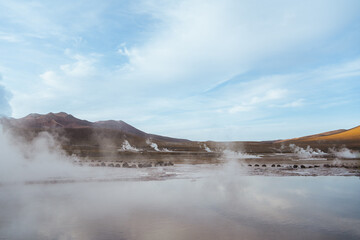 Tatio geysers field with reflection in the Atacama desert, Chile