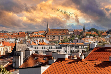 Picturesque Prague Rooftops with Historical Architecture and Dynamic Sky