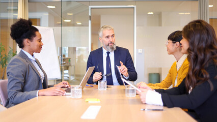 Mature businessman managing his team