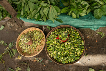 Fresh vegetables, peas, and leafy greens displayed at an open-air market in Beira, Mozambique.