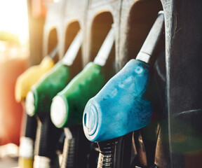 Petrol pump filling nozzles at Gas station